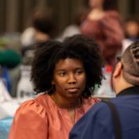 two people at table talking